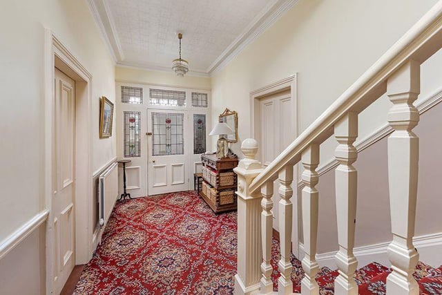 This home has the perfect mix of modern and vintage with this grand hallway.