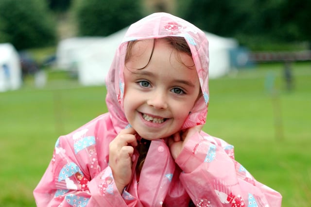 Natasha Warburton aged five  putting her hood up and enjoying the fair back in 2006 despite heavy rain