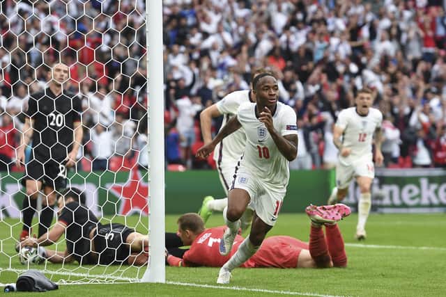 England's Raheem Sterling celebrates after scoring his side's opening goal during the Euro 2020 soccer championship round of 16 match between England and Germany, at Wembley stadium. (Andy Rain, Pool via AP)