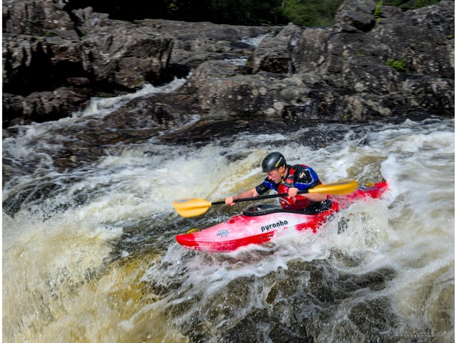 A skilled kayaker on River Tummell 
