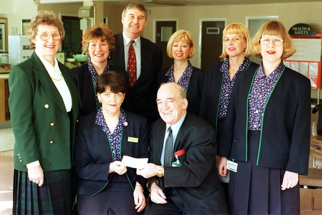 Staff from Doncaster's Marks and Spencer store on Baxtergate presented £10,039 to the St johns Hospice Appeal in 1998. Pictured presenting the cheque is Marks and Spencer main organiser Anne Chatfield seated left and president of the hospice appeal Lord Walker. witnessing the presentation are,left to right,   retired deputy supervisor Anne Brown , Joan Sprakes, store manager Graham Moss, Anne Cross, Jean Silcock and Anne Strudwick.