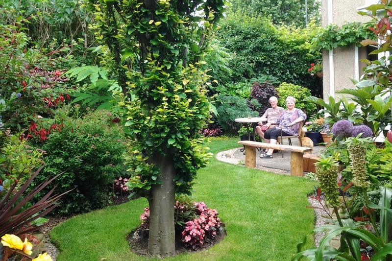 Award-winning gardeners Richard and Sharon Smithson relaxing in their beautiful garden at Hawksley Avenue, Newbold, in 2018.