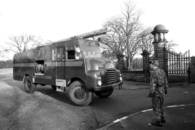 A Green Goddess fire engine arrives at Redford barracks in Edinburgh in November 1980.