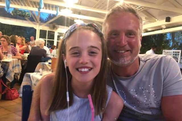 Stephen Bradbury is recovering after suffering brain injuries after being hurt in an incident while he was cycling. He is pictured with daughter Grace