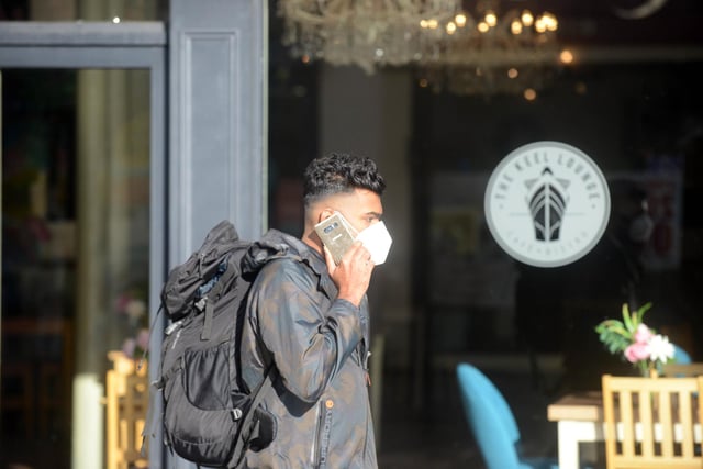 Wearing a mask didn't stop this man chatting on his mobile