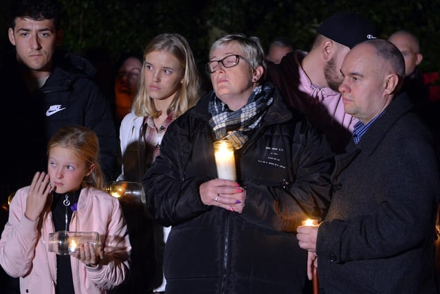 Gracie's mum, Alison Heaton, clutches a candle lit from the church’s Paschal candle