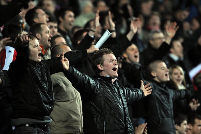 Happy Blades fans celebrate after seeing their side make history, with a club record run of 12 away games undefeated.