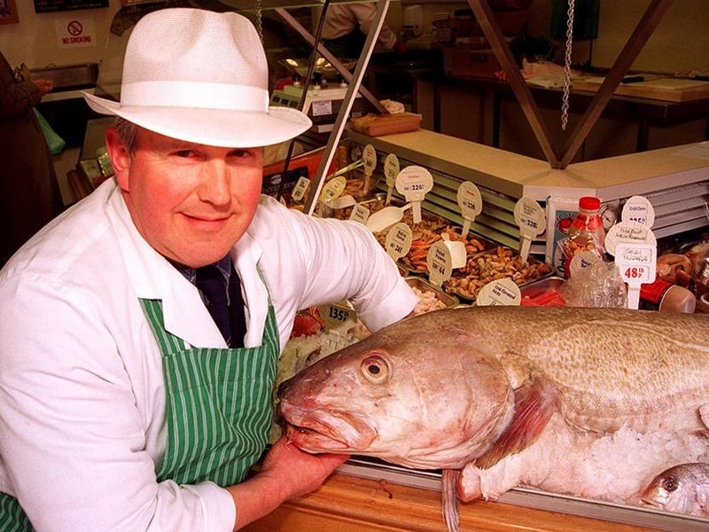 Pictured on Hillsborough Road, Sheffield, is Mr Peter Mann with the 5 stone cod fish in his shop window, March 1997