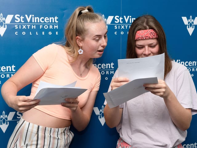 Millie Norton and Eloise Buzk check out their results at St Vincents College. Picture: Keith Woodland