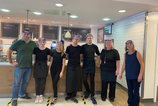 Dan (left) with the staff at the cafe in Debenhams on The Moor.