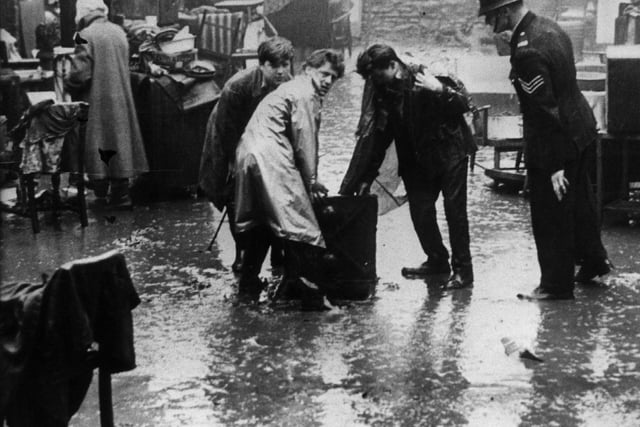 Families mopping up after floods hit Suffolk Road, Sheffield in 1958
