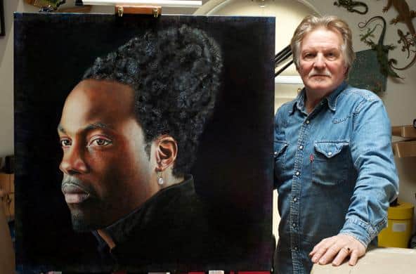 Artist Trevor Neal with his painting of Kidane Mariam