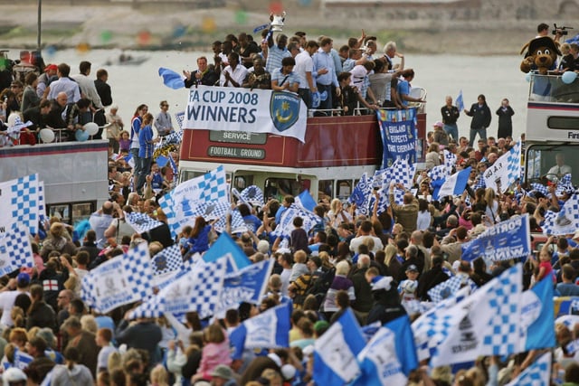 Portsmouth fans celebrates as their team arrive in a open top bus as part of their victory parade at Southsea Common following their win in the FA Cup Final 2008 on May 18 2008 in Portsmouth, England. Picture: Matt Cardy/Getty Images