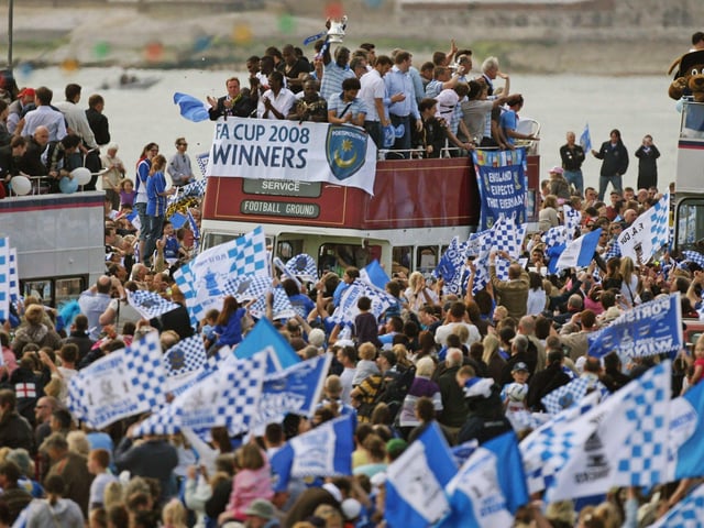 Portsmouth fans celebrates as their team arrive in a open top bus as part of their victory parade at Southsea Common following their win in the FA Cup Final 2008 on May 18 2008 in Portsmouth, England. Picture: Matt Cardy/Getty Images