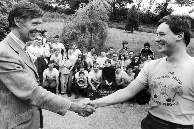 Members of the Chestnut Troop did a sponsored walk to raise money for the Cherry Tree Children's Home, Totley, Sheffield - July 9 1980
Picture shows in the foreground on the left Mr Derek Grayson, chairman of the home, congratulating Lt Peter Soar, organiser of the walk, with the walkers and some of the children at the home in the background.