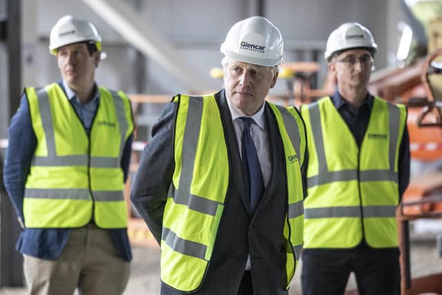 Prime Minister Boris Johnson visits the construction site of the new vaccines Manufacturing and Innovation Centre (VMIC) currently under construction on the Harwell science and innovations campus near Didcot on September 18, 2020 in Oxford, England. The building is being constructed to manufacture vaccines for Covid-19 and is set to open next summer. (Photo by Richard Pohle - WPA Pool/Getty Images)
