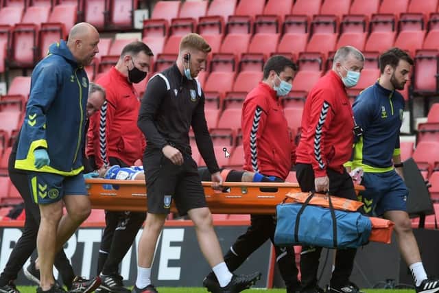 Sheffield Wednesday's Callum Paterson was stretchered off after sustaining a head injury in their draw at Charlton Athletic.