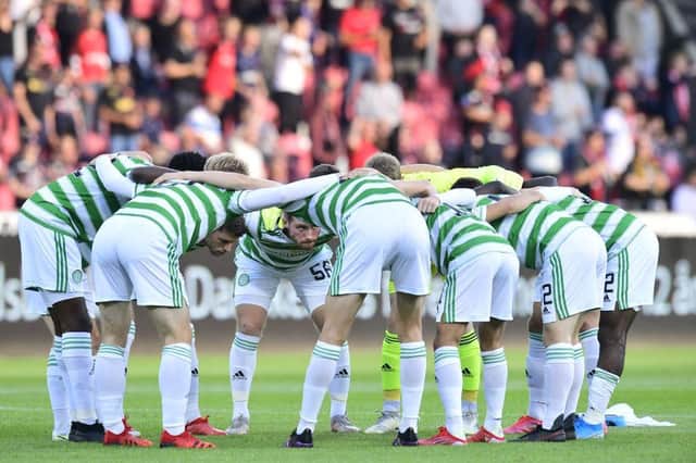 The Celtic players huddle up before kick-off. Picture: SNS
