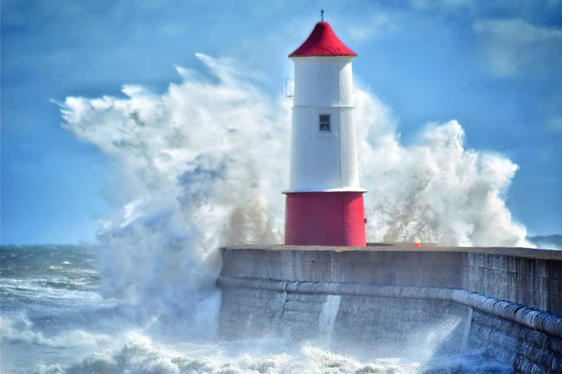 Berwick Lighthouse takes a battering from the waves.