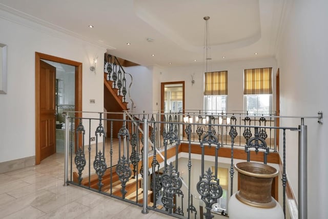 We're on our way to the first floor now as the oak stairs lead to this impressive galleried landing, with high ceiling. It gives access to five of the six bedrooms, with a further staircase leading to the sixth on the second floor.
