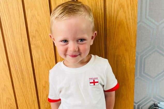 Alfie is all smiles in his England t-shirt.