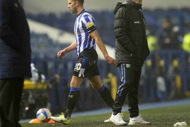 Owls substitute Jordan Rhodes walks past Sheffield Wednesday boss Tony Pulis after being hauled off in the closing stages of today's goalless draw with Stoke City at Hillsborough this afternoon. Photo: Steve Ellis