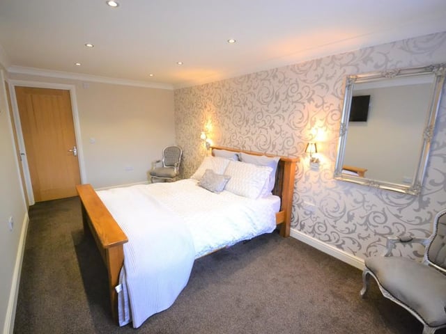 Master bedroom - An impressive generous sized double bedroom enjoying a pleasant outlook from a front facing upvc double glazed window. Having various power sockets, provisions for a wall mounted television. Central heating radiator, an Oak door opens to the ensuite with inset down lighting and coving to the ceiling.