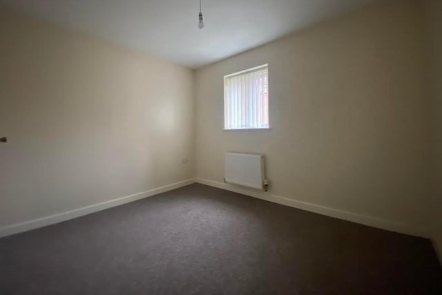 The second bedroom is slightly smaller than the other, but still a decent size. It has a window to the side, a carpeted floor and a double radiator.