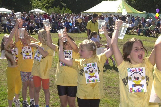 Pictured at the Dore recreation ground, where the Dore scouts gala was held. Seen in 2001 were Brownies from  1st Dore as they play the water game race, in frount of the large crowd.