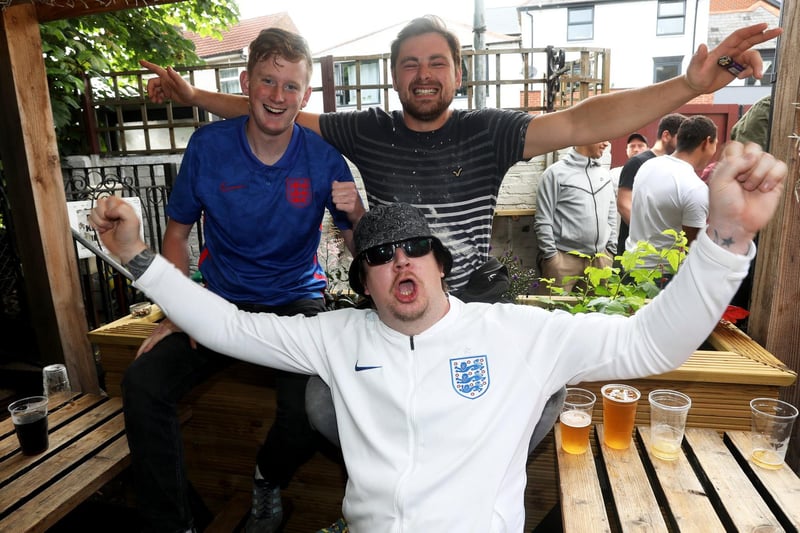 England fans pictured at the Milton Arms in Portsmouth, UK, about to watch England play on TV in the Semi-finals at Wembley. Pictured is Mark O'Neill (bottom) with friends enjoying the night. Picture: Sam Stephenson