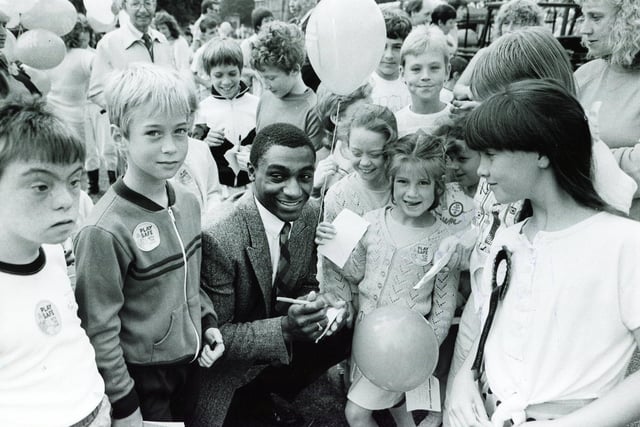 Herol 'Bomber' Graham signs autographs for young fans at the Junior Star Fun Day in Weston Park in September 1987