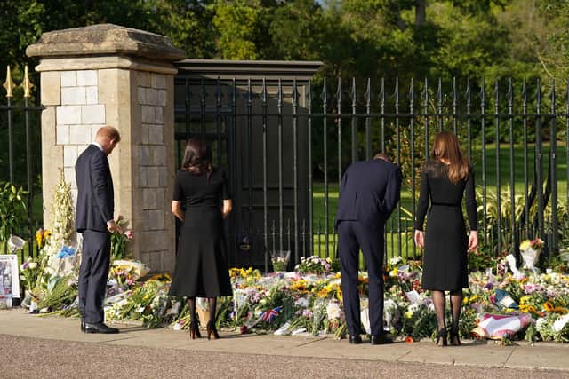 The Duke and Duchess of Sussex and the Prince and Princess of Wales, view flowers left by members of the public at Windsor Castle in Berkshire following the death of Queen Elizabeth II on Thursday. Picture: Kirsty O'Connor/PA Wire
