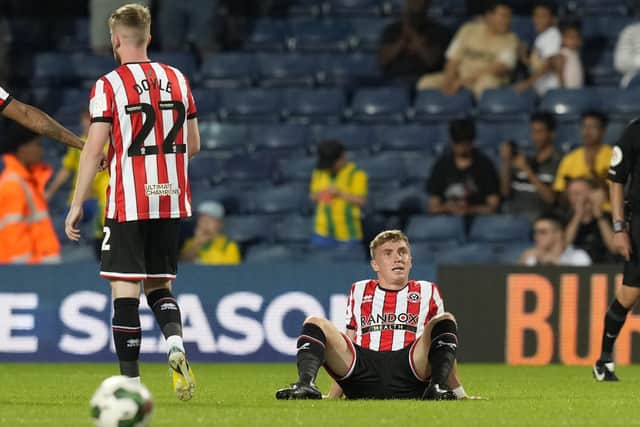 Ben Osborn of Sheffield United goes down injured at West Brom: Andrew Yates / Sportimage