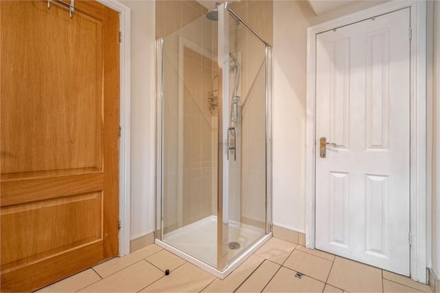 Shower room with floor access to cellar.