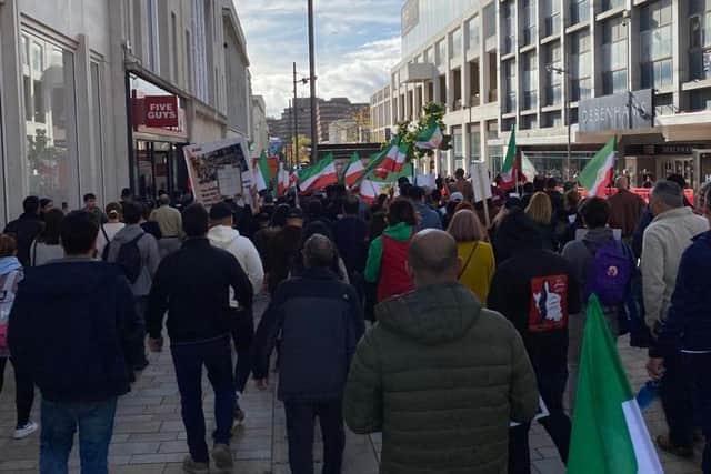 The rally moved through the city centre. The protests in Iran have led to 215 people being killed, including children.