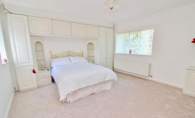 A very simple bedroom that really shows off the generous amount of accommodation this property has to offer, as well as providing plenty of storage space.