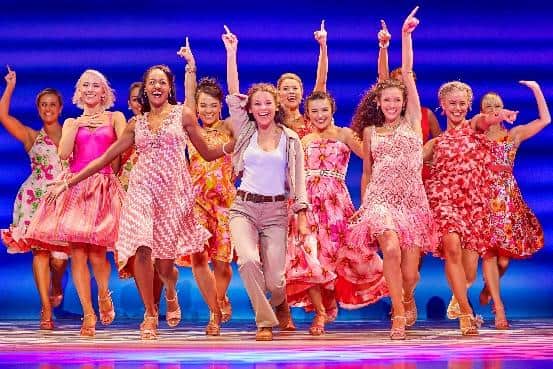 Members of the cast of Mamma Mia! on stage
