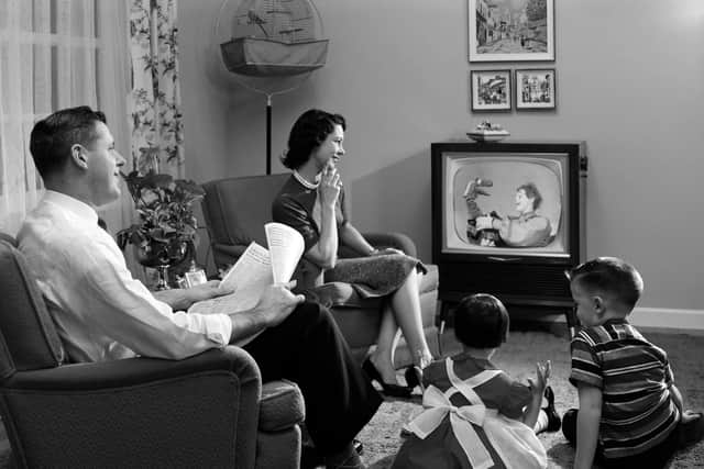 A family watching telly in the 1950s