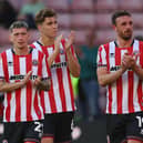 Sheffield United trio Louie Barry, Tyler Bindon and Jack Robinson applaud the fans after their opening-day Championship loss to Bristol City. Picture: Simon Bellis / Sportimage