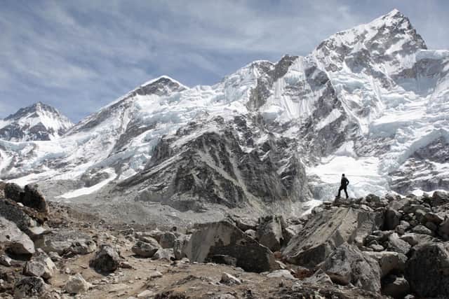 A hiker looks back down the Khumbu Valley, Nepal, where the Walking With The Wounded team are expected to begin their trek to Lobuche in the coming days. PRESS ASSOCIATION Photo. Picture date: Friday April 13, 2012. The Walking With The Wounded team relaxed at Mount Everest Base Camp today, ahead of a punishing acclimatizing regime on a nearby mountain. In the coming week they will trek back down the Khumbu Valley in the Himalayas and climb Lobuche (6,145m) twice in a matter of days. See PA story CHARITY Everest. Photo credit should read: David Cheskin/PA Wire