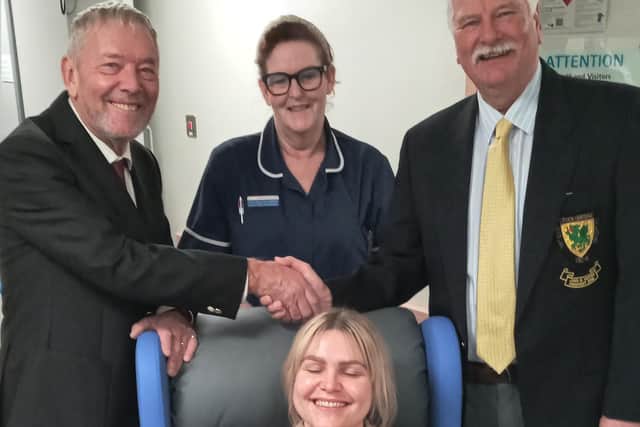 Alan Revill - Club Captain (Left), Ruth Ostrovskis-Wilkes - Staff Nurse (Centre), John Yeates - Club President (Right), Claire Heggarty - Staff nurse (In the Chair)