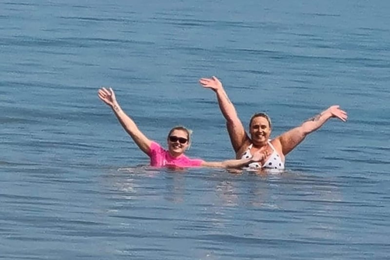Lynne Notley is pictured with her daughter enjoying a swim in the North Sea at Lunan Beach.