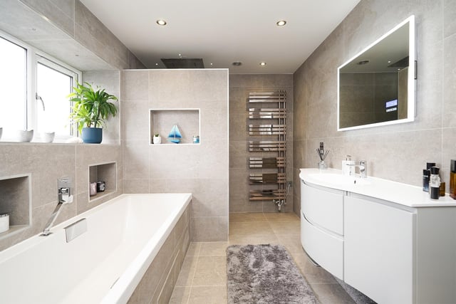 This stunning bathroom is also on the first floor. The finish is once again stunning, with a walk in shower just behind the wall in the photo.