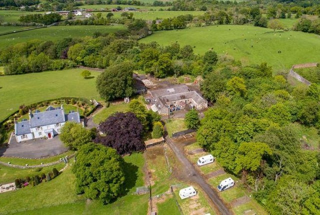 The property also includes traditional stone outbuildings, modern steading and agricultural land