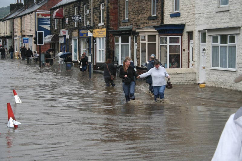 Brian Hatch's picture of people wading through Leppings Lane floods in June 2007