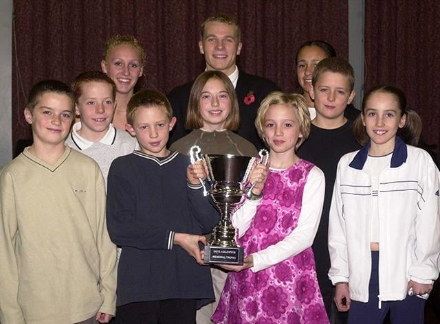 Dore Primary School pupils with the Dave Aizelwood Trophy and the other main winners of the school sports awards at Handsworth Grange School on November 10, 2000