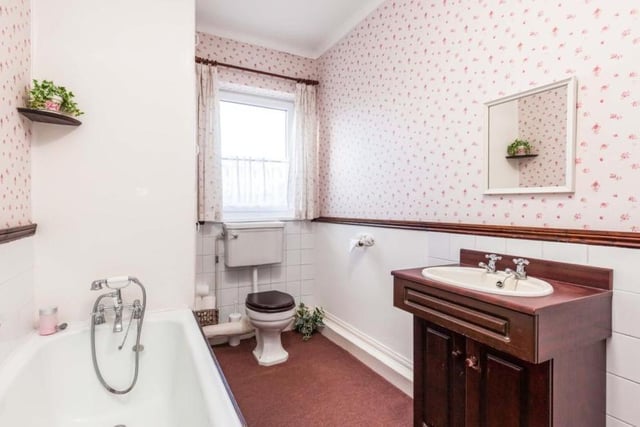 It's hard to fault the well-kept family bathroom, which consists of bath, low-flush WC and wash hand basin.