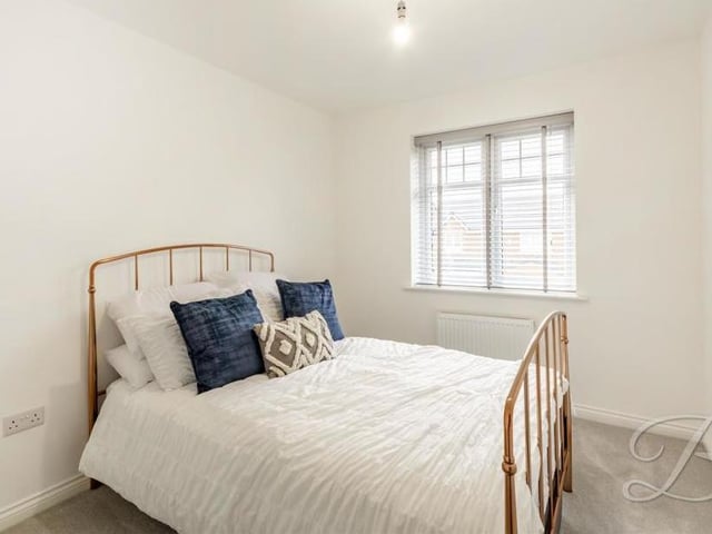 And so to the final bedroom, which is neat and compact with a carpeted floor, central-heating radiator and a window overlooking the back of the house.