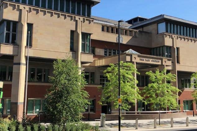Sheffield Crown Court, pictured, has heard how a man jointly accused of murdering Sheffield solicitor Khuram Javed has claimed he was attacked by the solicitor moments before the lawyer was shot dead.