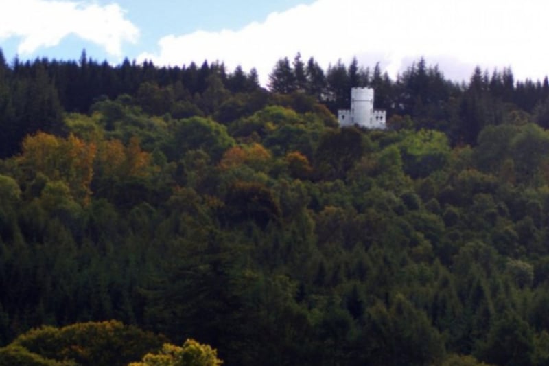 The tower is surrounded by Highland woodland.